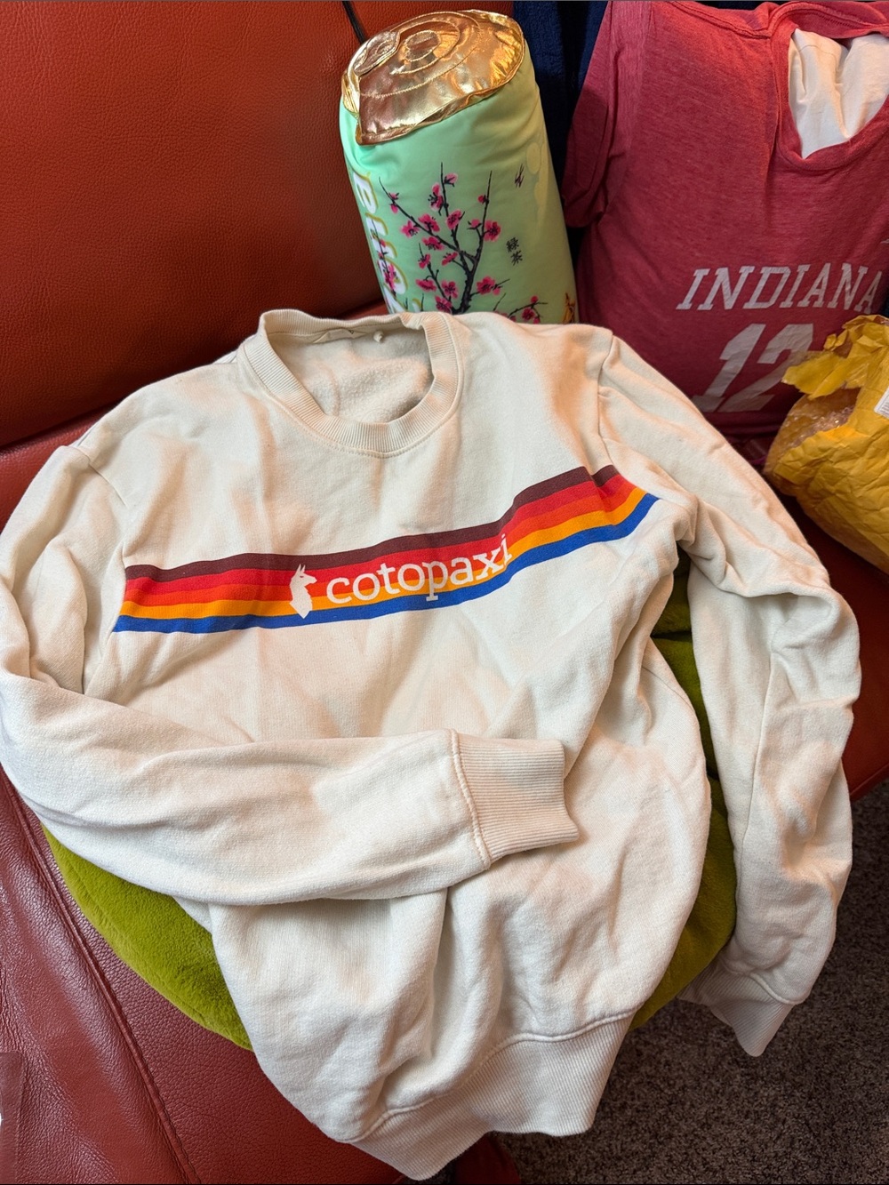 cotopaxi Cream Crewneck Sweatshirt with Red Orange Yellow Blue Stripe